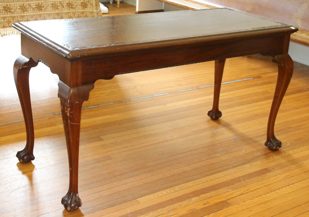 Mahogany Communion Table: Mahogany communion table with tapered legs and claw feet to rope-twist skirt and Florentine ornamented top, with carved inscriptions, 28" x 63". Provenance: The Second Congregational Church of