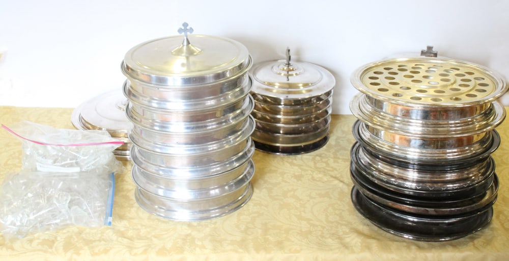 Silverplate and Aluminum Communion Ware: Silverplate and aluminum communion ware, including trays with bases, glass inserts and cross ornamentation, bread trays with bases and covers. Provenance: The Second Congregational Church of Beverly,