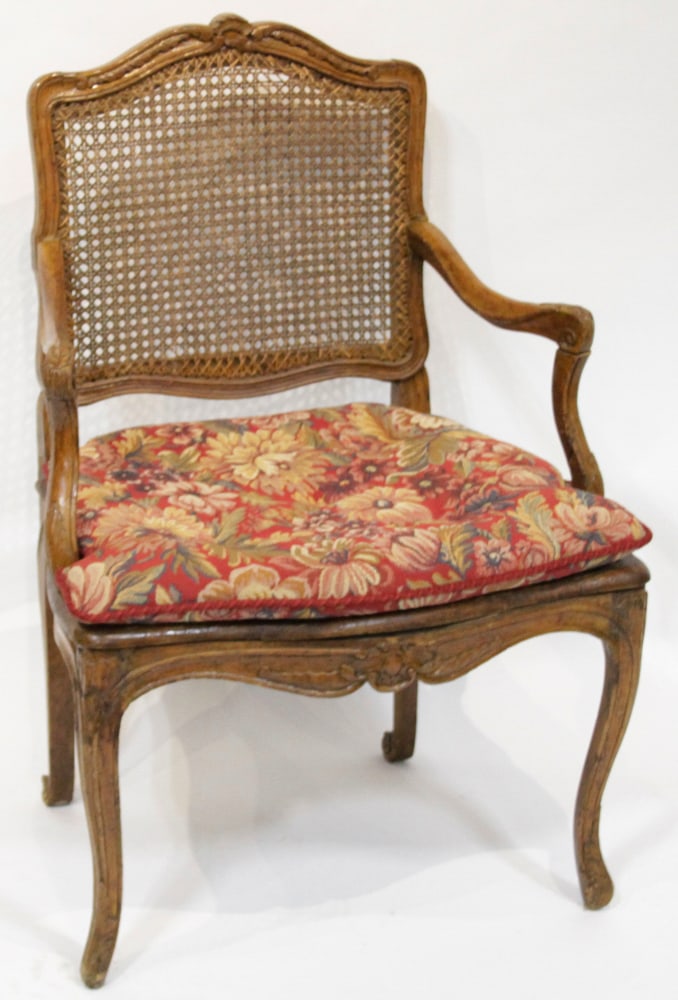 Vintage French Louis XV Style Armchair: Vintage French Louis XV style armchair with cane backrest and floral upholstered seat. Provenance: Palm Beach, Florida estate. PLEASE NOTE: This lot is not from the Second Congregational Church of Bev