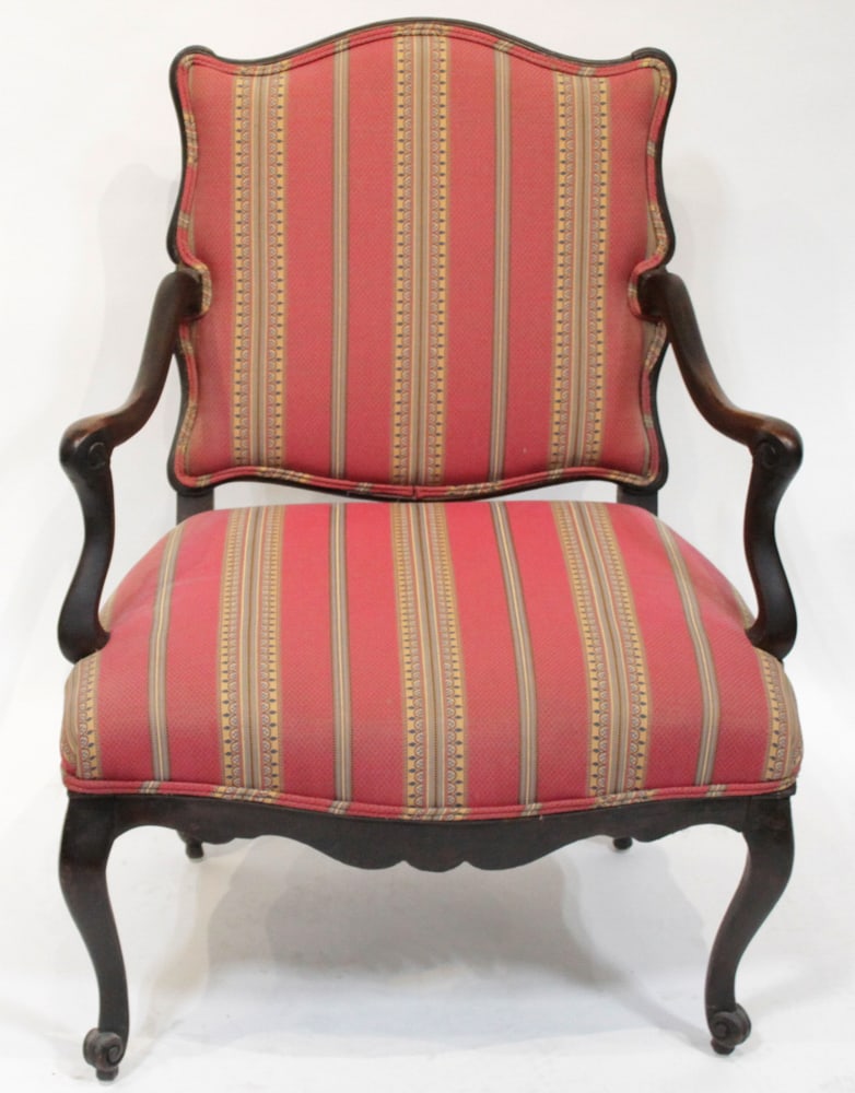 French-style Bergere with Striped Upholstery: French-style bergere, carved wood frame, striped upholstery, 38" H x 28" W x 27" D. Provenance: Palm Beach, Florida estate. PLEASE NOTE: This lot is not from the Second Congregational Church of Beverl