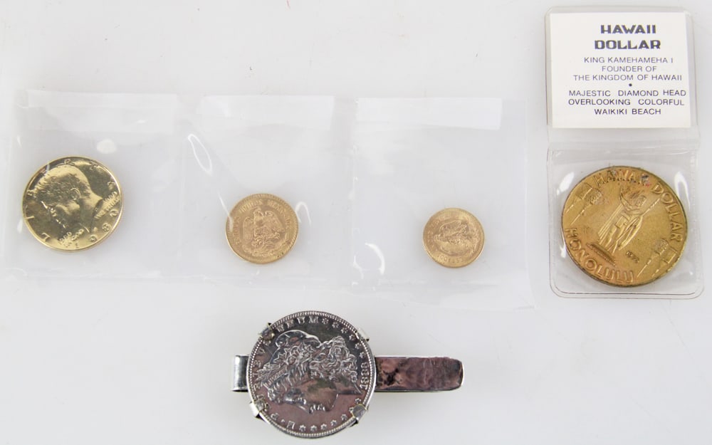 Group of Coins, Gold Pesos, Kennedy, Hawaii, etc.: Group of coins, to include: 1959 10-pesos gold coin, 8.36 grams; 1955 5-pesos gold coin, 4.17 grams; Kennedy half dollar; 1975 Hawaii dollar; 1883 silver dollar. Provenance: Montecito, California coll