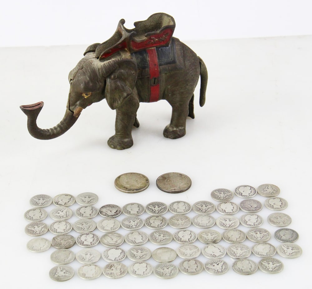 Coins, Liberty Dollars, Barber Quarters, Elephant Bank: Coins, including: 1922 and 1923 Liberty silver dollars; (53) Barber quarters (1892-1916); cast iron elephant bank with money inside. Provenance: Palm Beach, Florida estate. PLEASE NOTE: payment for