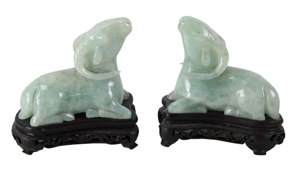 Pair of Chinese Hardstone Jade Recumbent Rams: Pair of Chinese hardstone jade recumbent rams, 2" on 3/4" stand; 2 1/2" W. Provenance: Estate of Thomas Nicholson of Palm Beach, Florida and Stratham, New Hampshire.