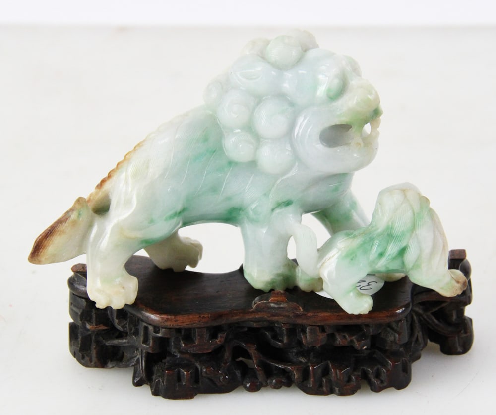 Chinese Jadeite Guardian Lion and Pup: Chinese jadeite guardian lion and pup, non-traditional pose, highly polished, 3 1/4" x 5 1/2" x 2". Provenance: Estate of Thomas Nicholson of Palm Beach, Florida and Stratham, New Hampshire.