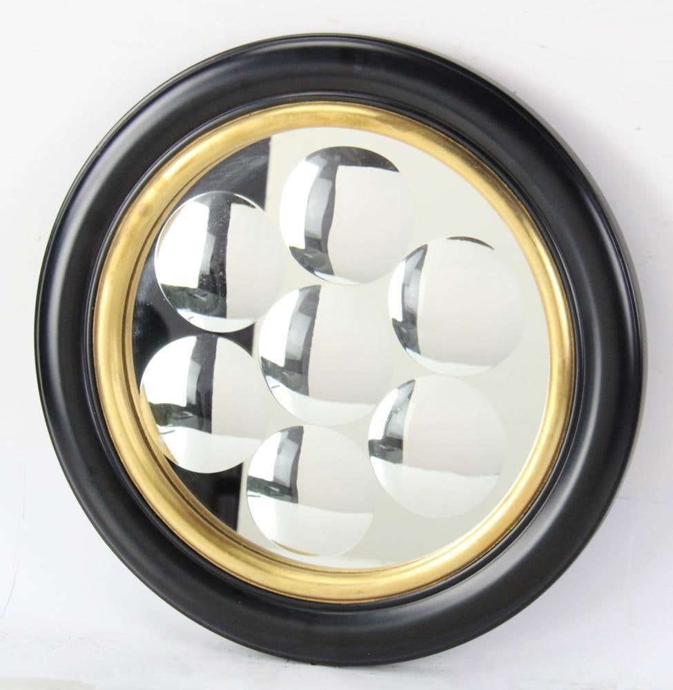 Sorcerer's Mirror with Convex Roundels: Sorcerer's mirror with convex roundels, ebony-framed, 16 3/4" diameter. Good condition. Provenance: Estate of Dalia Zikas of Melrose, Massachusetts.