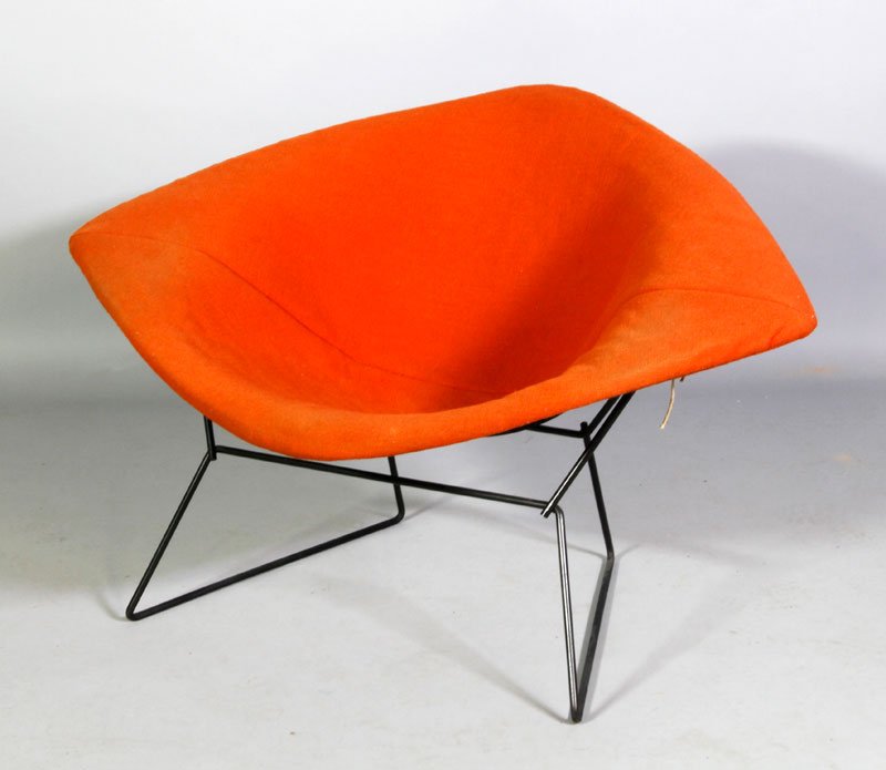 Bertoia Upholstered Chair: Harry Bertoia chair, orange upholstery on wire base, Knoll label, all original with rubber shock mounts, 27"h x 45"w x 30 1/2"d. Aging to upholstery. Provenance: from a Newton, Massachusetts collectio