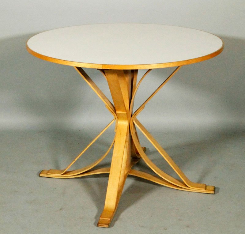 Knoll "Face Off" Table: Frank Gehry for Knoll "Face Off" table, bentwood base with white laminate top, circa 1999, wood burned signature and mfg marks, original line label, 29"h x 36"dia.
