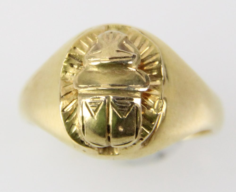 18k Yellow Gold Scarab Ring: 18k yellow gold scarab ring with Egyptian hallmarks, size 8. Approximately 7.27 grams TW. Provenance: Miami Beach, Florida collection. PLEASE NOTE: payment for silver, gold, jewelry, and coins must be
