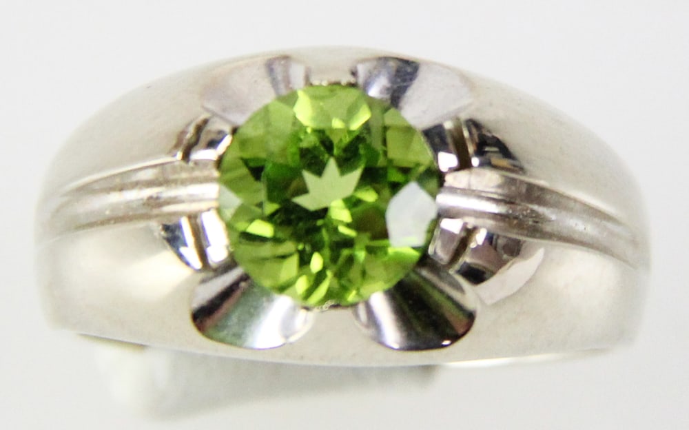 14k Gold Peridot Ring: 14k gold and peridot ring, size 8. Approximately 6.43 grams TW with stone. Provenance: Miami Beach, Florida collection. PLEASE NOTE: payment for silver, gold, jewelry, and coins must be made via wire 
