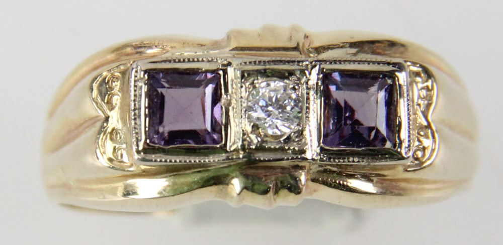 14k Yellow and White Gold Garnet and Diamond Ring: 14k yellow and white gold ring with (2) garnets and 0.15 ct diamond center, size 13 1/2. Approximately 6.19 grams TW with stone. Provenance: Miami Beach, Florida collection. PLEASE NOTE: payment for s