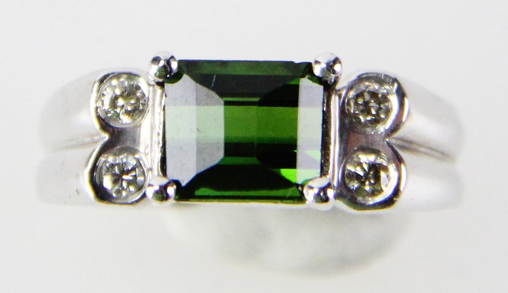 14k White Gold Tourmaline and Diamond Ring: 14k white gold ring with oblong tourmaline and (4) accent diamonds, size 6. Approximately 3.82 grams TW with stones. Provenance: Miami Beach, Florida collection. PLEASE NOTE: payment for silver, gold,