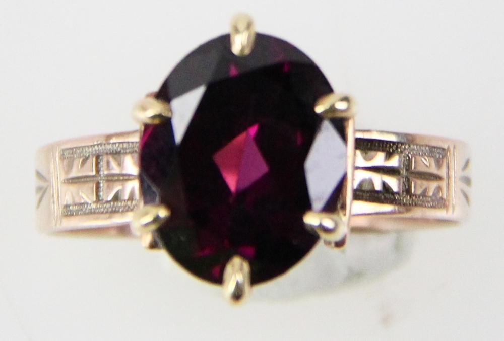 14k Rose Gold Oval Garnet Ring: 14k rose gold ring with oval garnet, size 7. Approximately 2.67 grams TW with stone. Provenance: Miami Beach, Florida collection. PLEASE NOTE: payment for silver, gold, jewelry, and coins must be made