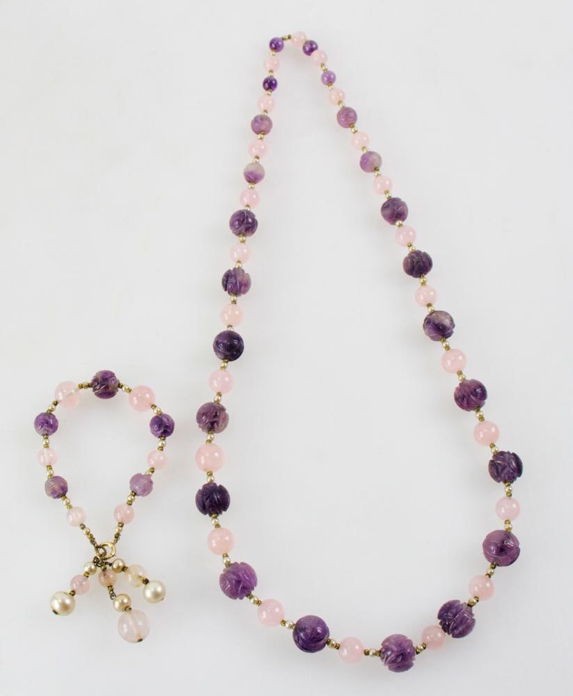 Carved Amethyst and Pink Quartz Necklace and Bracelet: Carved amethyst necklace with pink quartz, approximately 29" L, and matching bracelet. Provenance: San Diego, California collection. PLEASE NOTE: payment for silver, gold, jewelry, and coins must be m