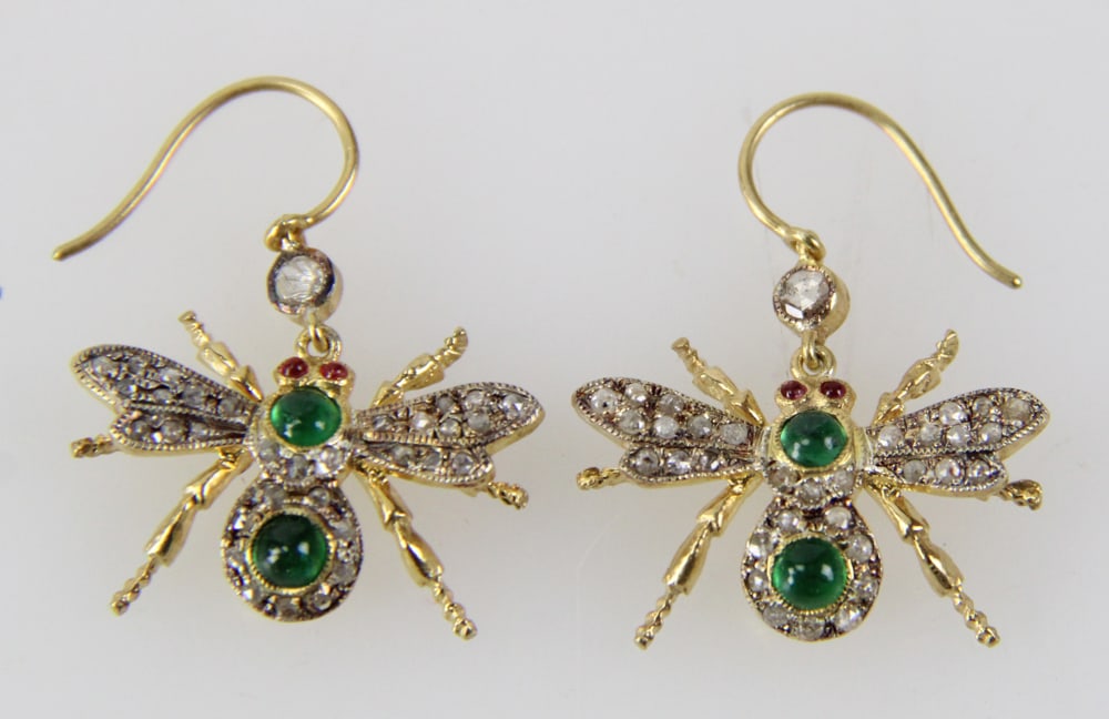 Pair of Sterling Butterfly Earrings with Gemstones: Pair of sterling butterfly earrings with (68) rose cut diamonds, approximately 0.60 ctw, (4) emeralds, approximately 0.50 ctw, and (4) rubies, approximately 0.08 ctw, 1 1/8" H x 1" W. Approximately