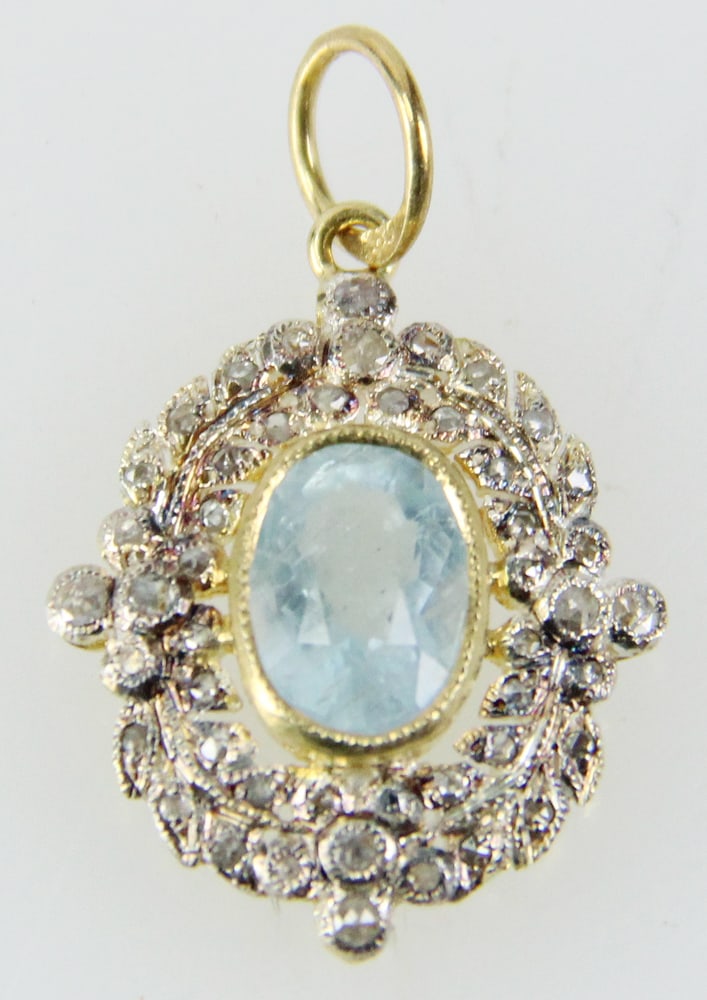 Sterling Pendant with Diamonds and Aquamarine: Sterling pendant with 14k gold bail, (48) rose cut diamonds, approximately 0.35 ctw, and aquamarine, approximately 1.5 ct. 3/4" x 5/8". Approximately 1.9 grams TW. Provenance: Bangkok, Thailand collec