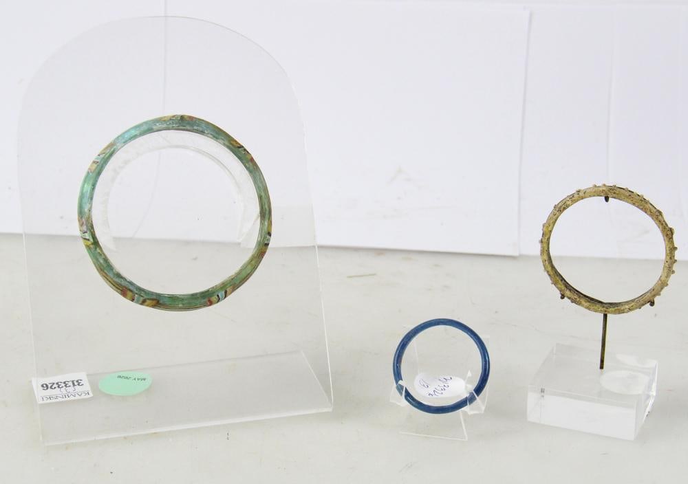 Group of Roman Glass Bracelets: Group of (3) Roman glass bracelets, 1-4 AD (CE), largest 3 1/2", smaller child bracelet 1 1/2". Provenance: Vero Beach, Florida collection.
