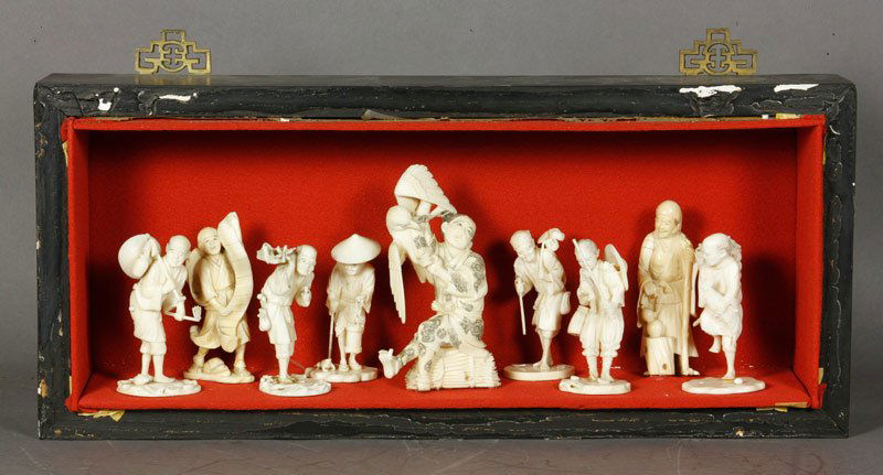 Japanese Group of 9 Ivory Figures: Group of nine carved ivory figures, Japan, in shadow box case, 8 1/2" x 19 1/2".