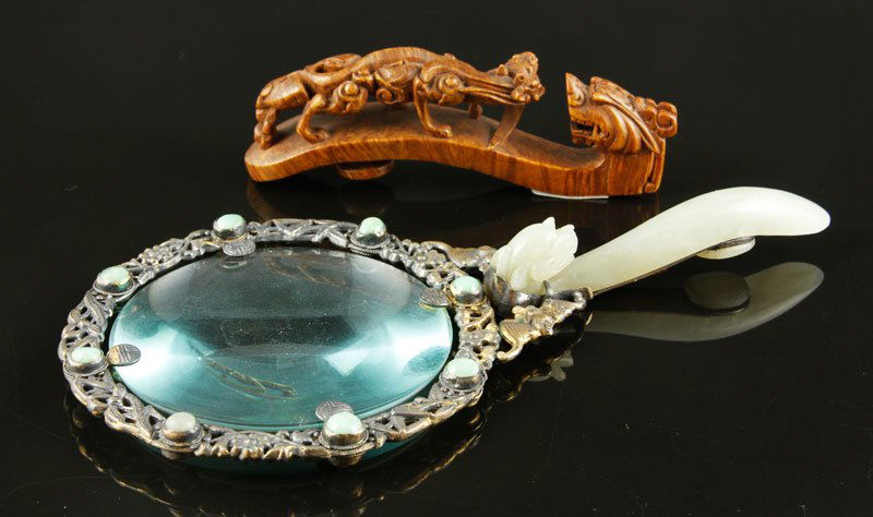 Chinese Clothing Hooks: Lot of two clothing hooks, one hardwood carved as dragons, 4" l, the other mutton fat jade mounted on gilt metal ornate magnifying glass frame, 7" l, China.