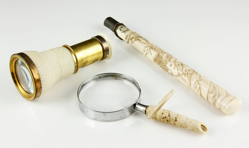 Lot of Three Carved Ivory Pieces: Lot of three carved ivory pieces, to include: one ivory parasol handle with silver ferrule, carved overall with Japanese figures among leaves, 8 1/2" long, one 4 3/8" long small brass spy glass with m