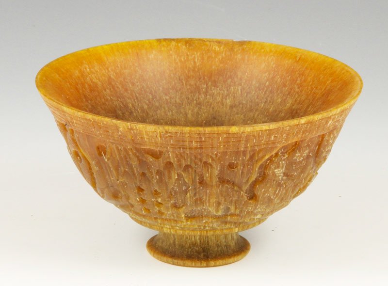 Chinese Carved Horn Cup: Carved horn cup, China, carved with a pair of figures and a pair of bats, 2 3/8" x 4 3/8".