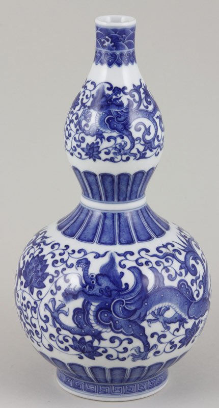 Chinese Blue and White Vase: Blue and White Gourd Vase, China, Qianlong mark on base, painted with dragons amidst scrolling lotus flowers, mark on base, 8 1/2" x 4".