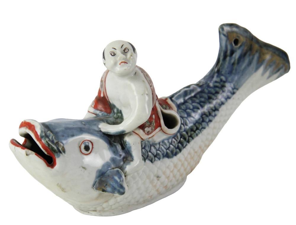 19thC Japanese Edo Period Arita Porcelain Vase: 19th century Japanese Arita porcelain vase, Edo Period, modeled as "Kentaro Riding a Carp". Red #231 on bottom from previous collection, 5 1/2 x 10. Provenance: Estate of the late Joseph W. Haley, of