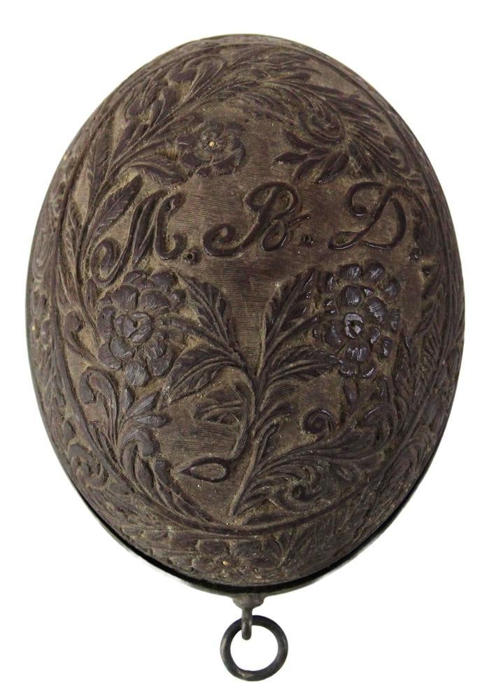 Old Scarab and Carved Coconut: Old scarab and carved coconut, initialed MBD, 2 x 4 x 3. Provenance: Estate of the late Joseph W. Haley, of Pride's Crossing, Massachusetts.