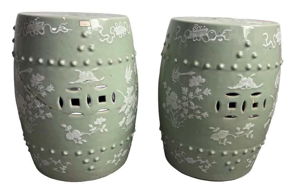 Pair of Chinese Garden Seats: Pair of Chinese porcelain garden seats in celadon and white overglaze. One with large restored crack on side. Provenance: Estate of the late Joseph W. Haley, of Pride's Crossing, Massachusetts.