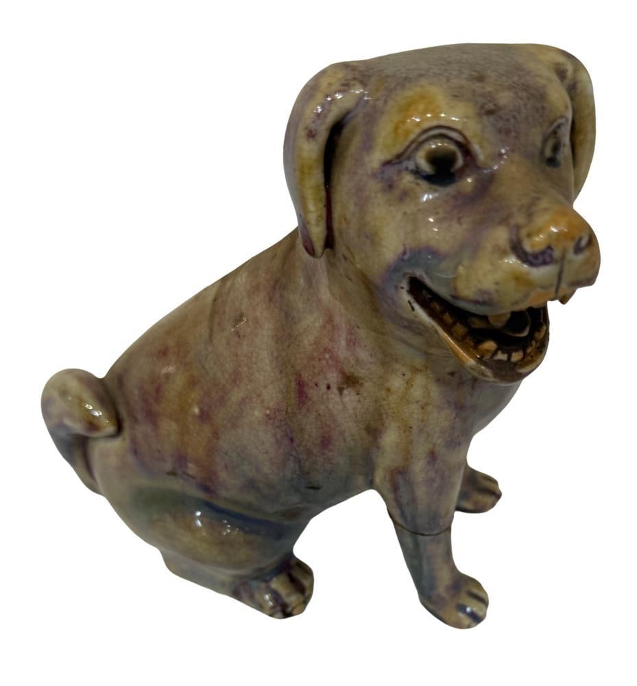 Chinese Glazed Porcelain Dog: Chinese glazed porcelain dog, 7" x 6". Repair on front leg. Provenance: Estate of the late Joseph W. Haley, of Pride's Crossing, Massachusetts.