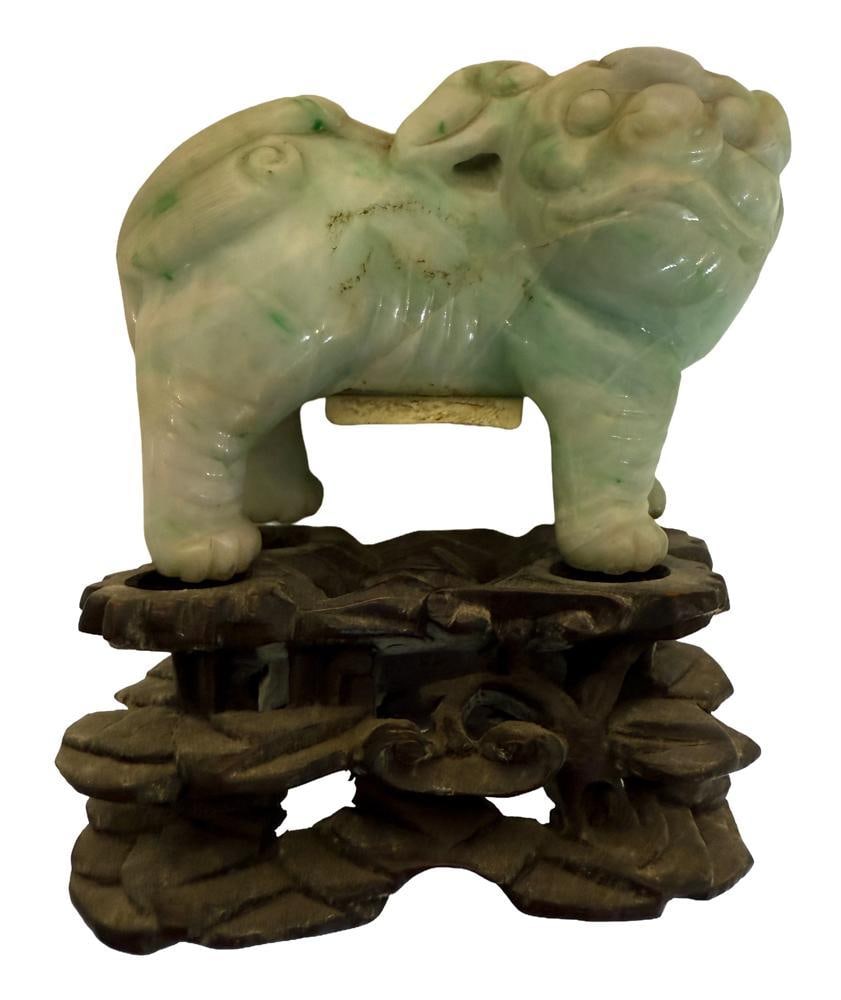 Chinese Jade Foo Dog on Stand: Chinese jade foo dog on stand. Provenance: Estate of the late Joseph W. Haley, of Pride's Crossing, Massachusetts.