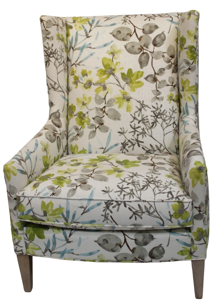High-Back Upholstered Wing Chair: High-back upholstered wing chair, cream fabric with branches and olive green flowers. Provenance: New York estate.