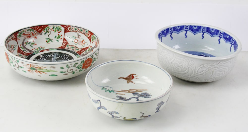 Group of Three Asian Bowls, Imari, Klapmuts: Three Asian bowls, to include: Imari porcelain bowl, 1868-1912, 3" x 11"; herons bowl, 3" x 9"; antique Chinese porcelain bowl known as a "Klapmuts" bowl from the Kangxi period. Provenance: Beverly,