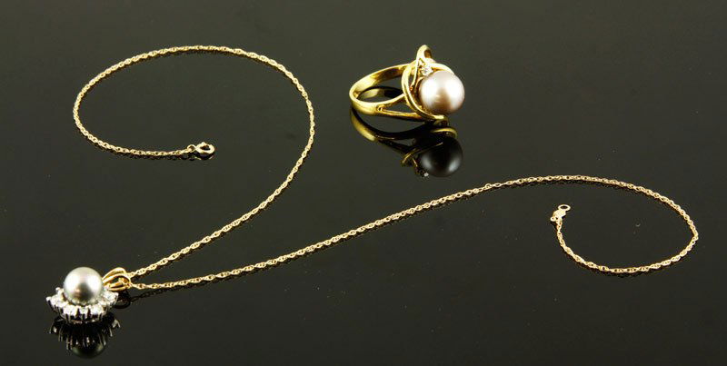 2 Pieces Gold, Diamond and Peal Jewelry: Yellow gold, diamond and pearl ring and pendant on necklace: ring 18K, 9.5-10.0mm lustrous black pearl, 0.03 CTW diamond, size 8; pendant 14K, 8.0mm lustrous black pearl, 0.5 CTW diamonds, 14K chain,
