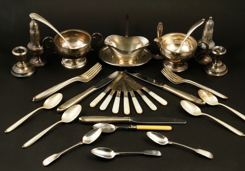 Assorted Sterling Silver: Lot of assorted sterling silver, to include: three knives, two ladles, four soup spoons, three teaspoons, five forks, seven pearl handled butter knives, one odd spoon, one crumb pusher, assorted weigh
