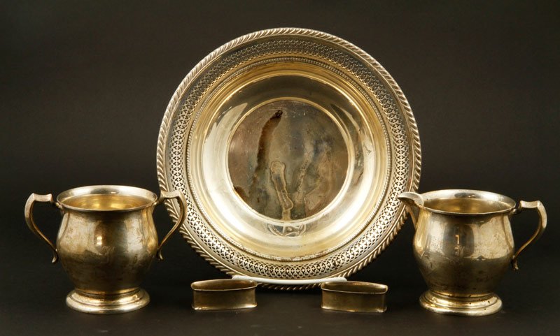 Assorted Sterling Hollowware: Lot of assorted sterling silver hollowware, some monogrammed, including cream and sugar, two napkin rings and Gorham reticulated bowl, 9 1/2", total weight approximately 19 ozt.