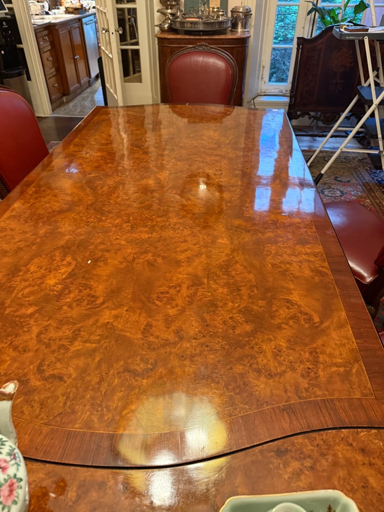 1920s Deco Burlwood Dining Table: 1920s Deco burlwood dining table with (6) 40" leaves, 30" H x 114" L x 42", fully extended 154". With some pads. NOTE: Item to be picked up at 64 East 80th St., New York, NY. Deadline for pick-up is