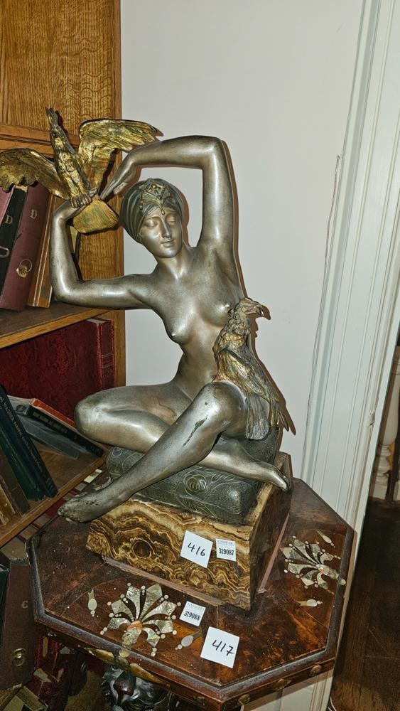 Affortunato Gory, Silvered Bronze of Nude Woman: Affortunato Gory (French/Italian, 1895-1925), silvered Orientalist bronze of a nude woman, seated, a bird in her raised arms, on onyx base, incised signature to base, 24" H x 13" W. NOTE: Item to be p