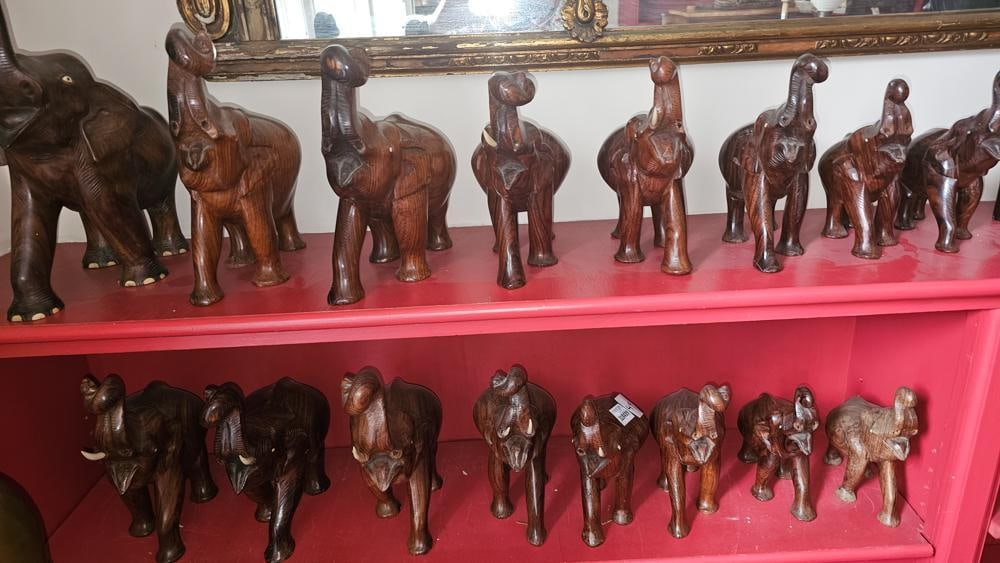 Group of Carved Wood Elephants: Group of (16) carved wood elephants set (8), tallest 11". NOTE: Item to be picked up at 62 East 80th St., New York, NY. Deadline for pick-up is July 31st. Please call our front desk at 978-927-2223 to