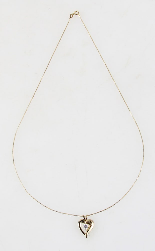 14k Yellow Gold Cubic Zirconia Pendant on 14k Chain: 14k yellow gold pendant with cubic zirconia on 14k yellow gold 18 1/2" chain. Pendant 5/8" H. Approximately 2.2 grams TW. Provenance: Gloucester, Massachusetts collection. PLEASE NOTE: payment for sil
