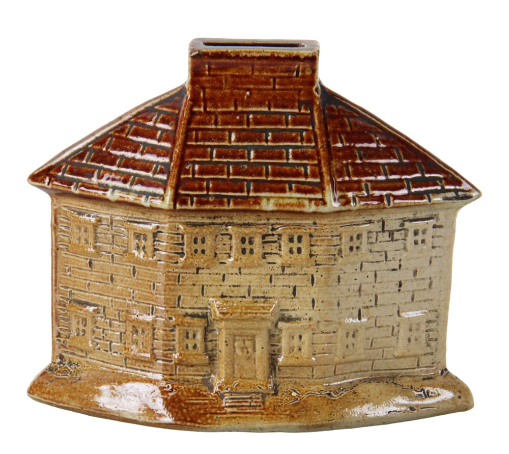 19thC Staffordshire Pearlware Cottage Penny Bank: 19th century Staffordshire pearlware "Cottage" penny bank. An early Victorian ceramic money box modeled as a two-story manor house. Featuring a hipped brickwork roof with a central chimney coin slit.