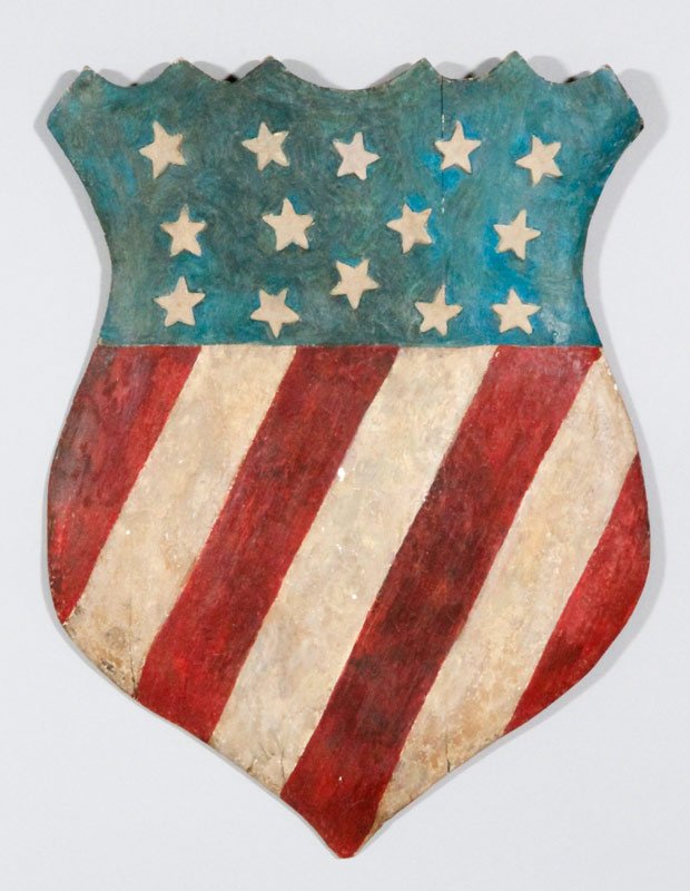 American Flag Painted Shield: American flag painted shield, polychrome and carved, 31"h x 23"w.