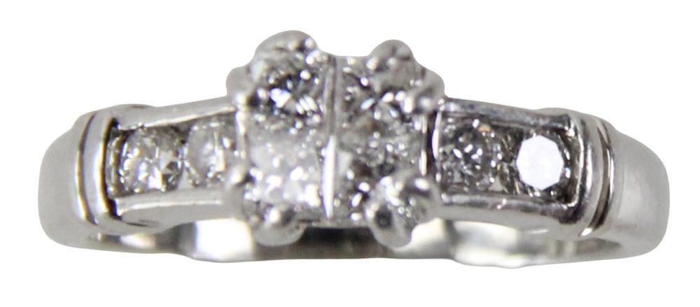 Platinum and Diamond Ring: Platinum and small diamond ring. Ring size 8. Approximately 8.0 grams TW. Provenance: Peterborough, New Hampshire collection. PLEASE NOTE: payment for silver, gold, jewelry, and coins must be made via