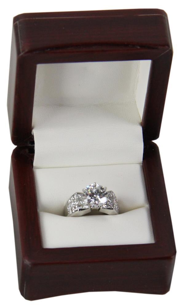 Platinum Diamond Ring: Platinum diamond ring, 3.04 ct, F color, VVS2 clarity, with (30) princess cut diamonds, approximately 2.10 ctw, invisible set on the shank. Replacement value $195,500. Provenance: Fairfield, Connectic