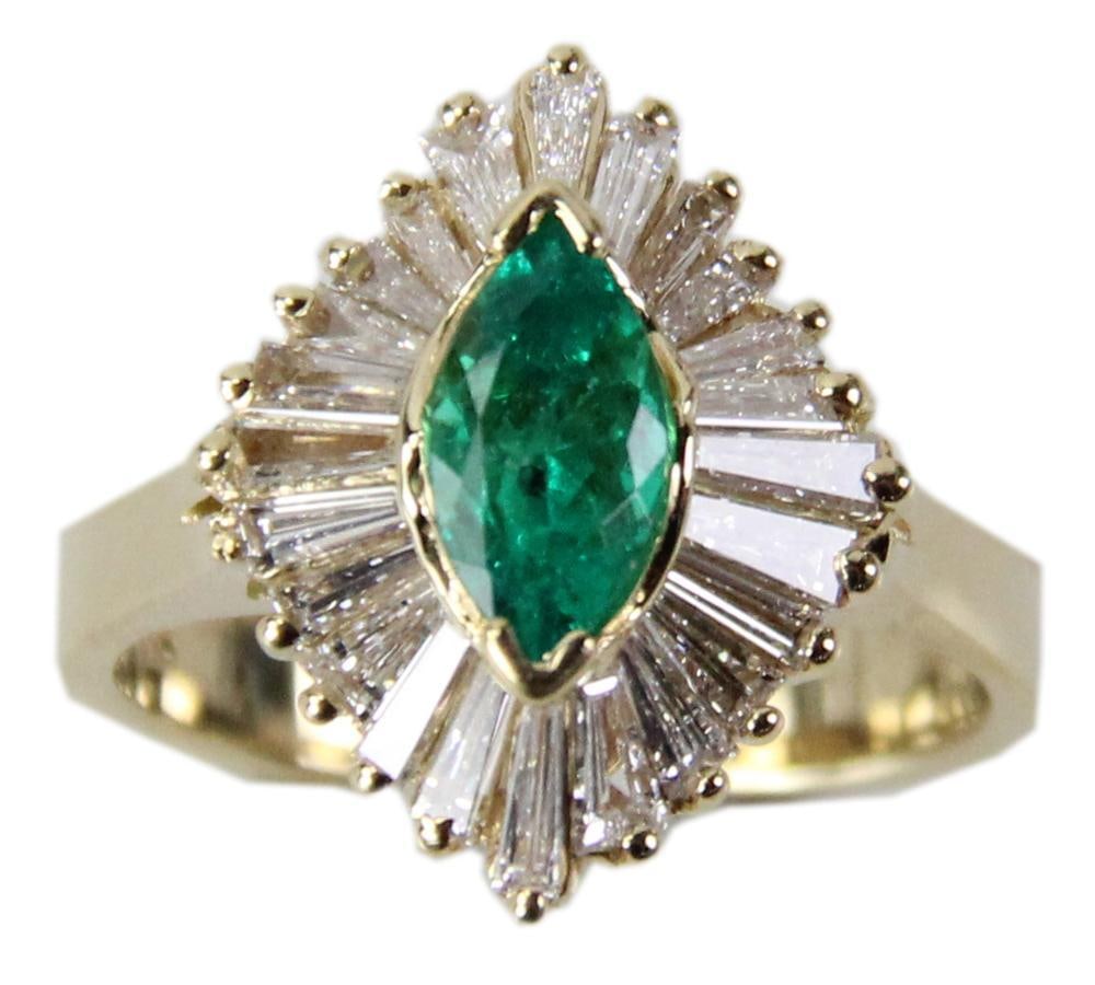 14k Yellow Gold Emerald Ballerina Ring: 14k yellow gold emerald ballerina ring, marquise cut Colombian emerald approximately 0.85 ct, (24) tapered diamond baguettes, approximately 2.0 ctw. Ring size 6. Replacement value $8850. Provenance: F