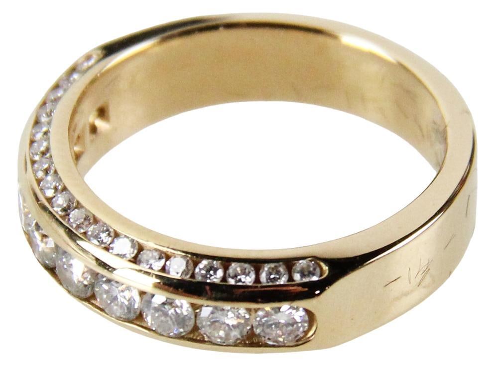 14k Yellow Gold Diamond Band Ring: 14k yellow gold diamond band ring with (46) round brilliant cut diamonds, approximately 1.06 ctw, H-I color, VS/SI clarity. Approximately 3.5 dwt, 5.5 grams. Ring size 6 3/4. Replacement value $4500. 