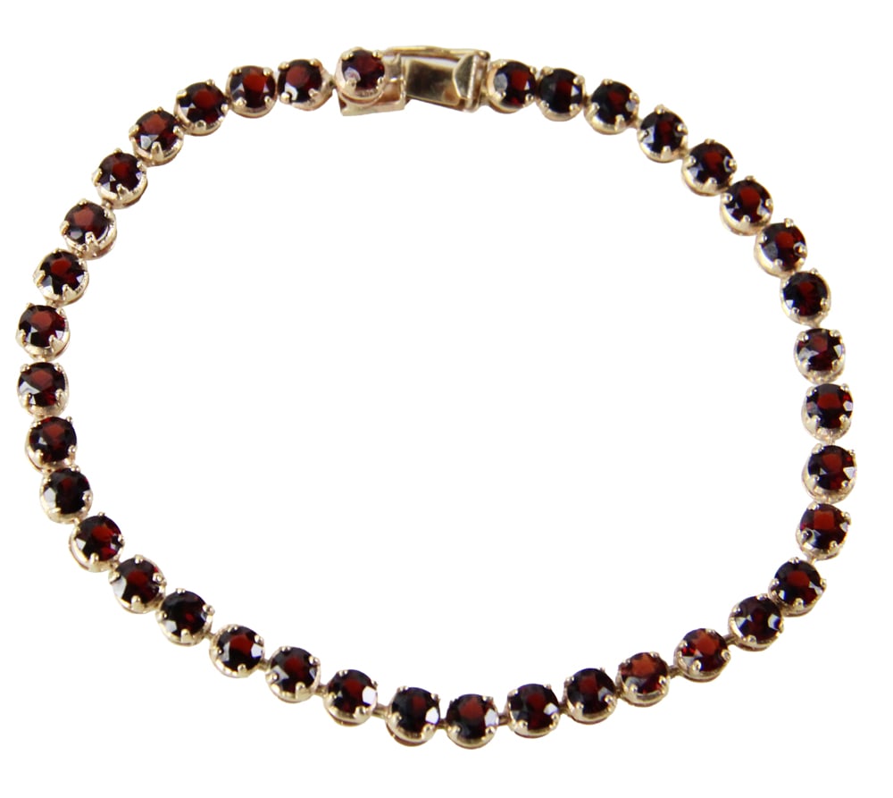 14k Gold and Garnet Tennis Bracelet: 14k gold and garnet tennis bracelet. Approximately 9.0 grams TW. Provenance: Peterborough, New Hampshire collection. PLEASE NOTE: payment for silver, gold, jewelry, and coins must be made via wire tra