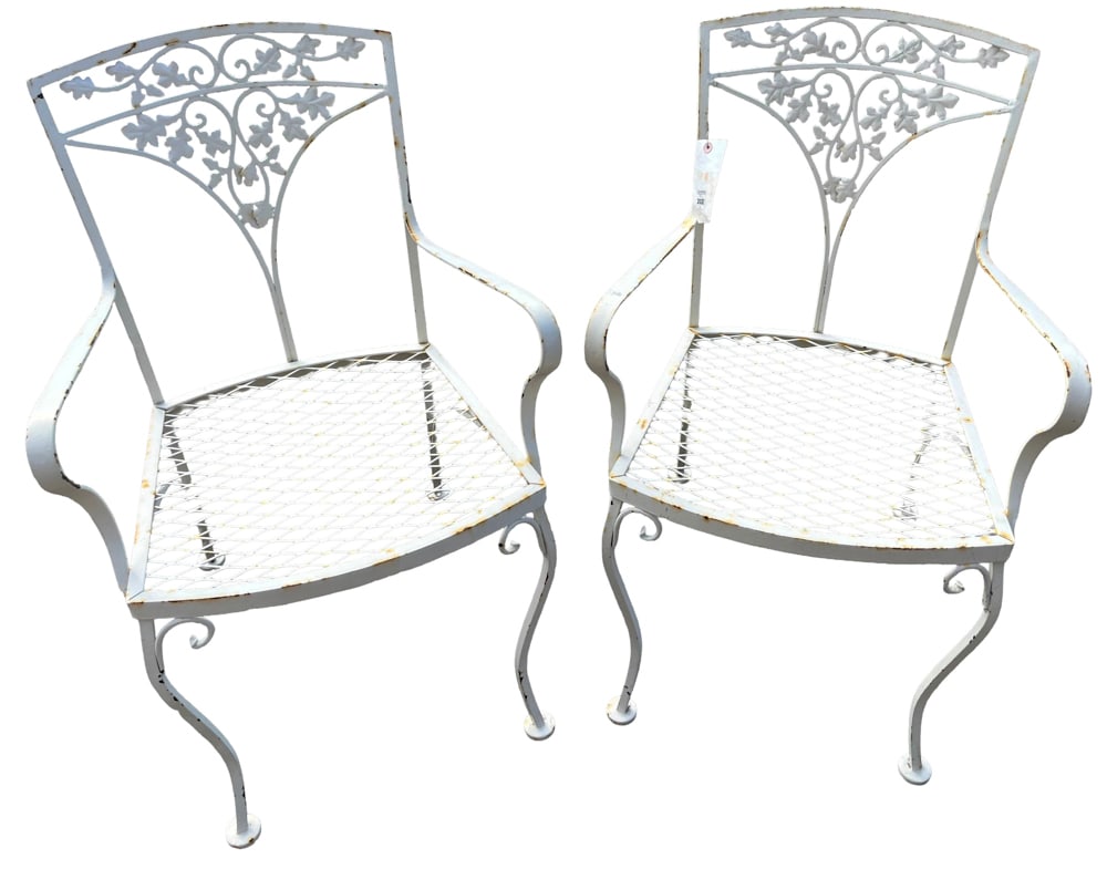 Pair of Vintage Woodard Wrought Iron Patio Dining Chairs: Pair of vintage Woodard wrought iron patio dining chairs, vine scrollwork on back rests, 34" H x 21" W x 17" D. Provenance: Cambridge, Massachusetts collection.