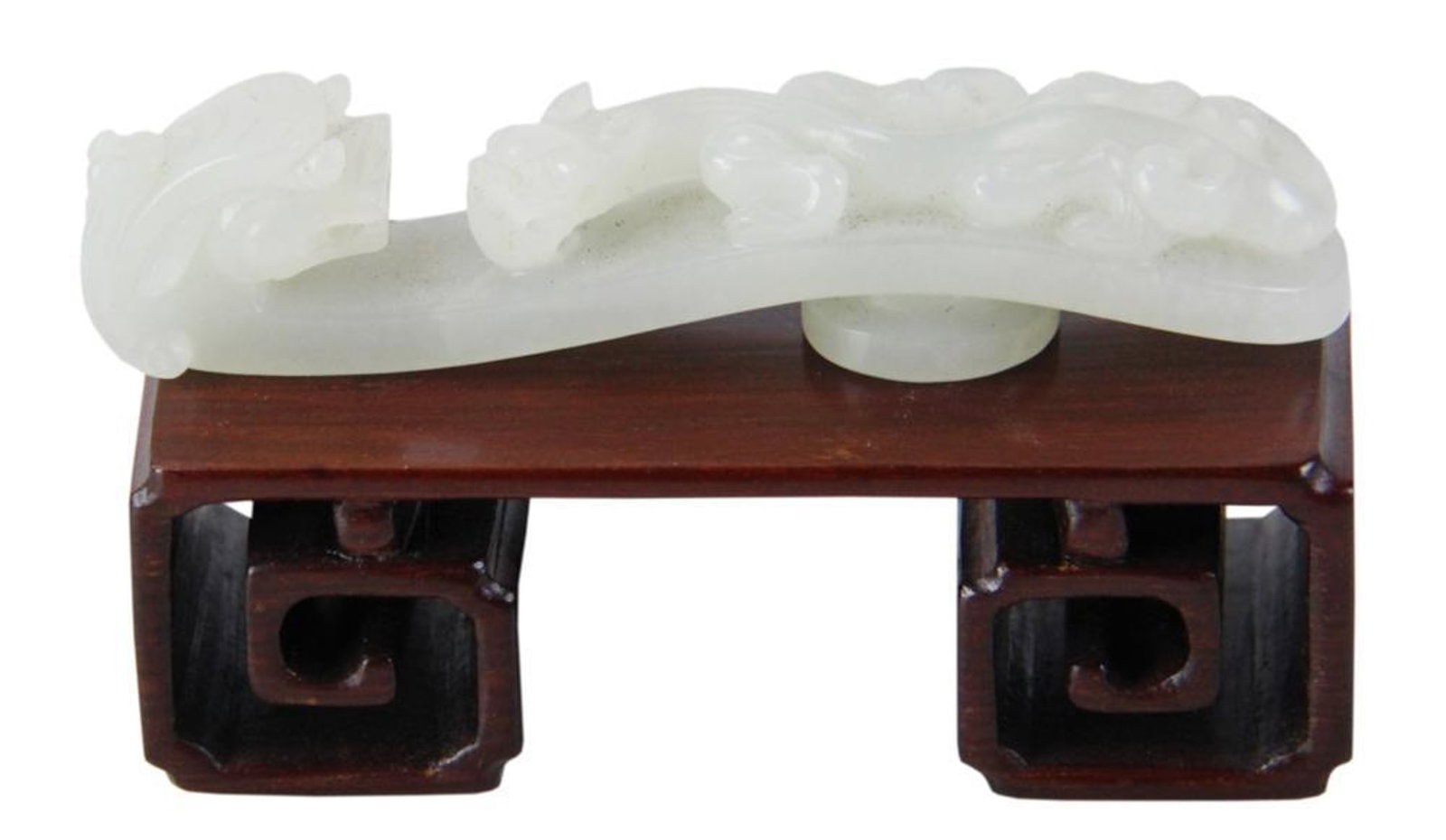 Chinese White Jade Belt Hook: Chinese white jade belt hook, sharp edged carving, on custom stand, 3/8" x 3 1/2" x 3/4". Provenance: Palm Beach, Florida and Stratham, New Hampshire.