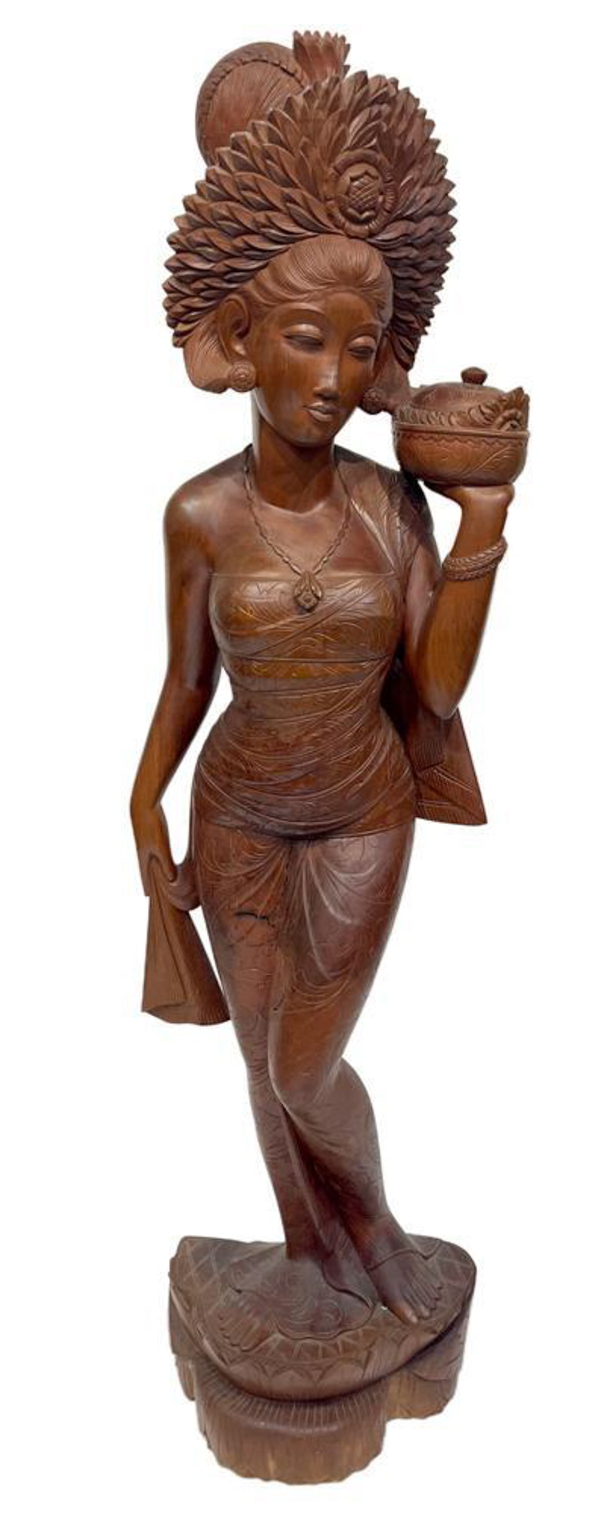 Hand-crafted Wooden Statue from Bali of Woman: Hand-crafted wooden statue from Bali of Indonesian woman in traditional attire, 60" H x 16". Provenance: Beverly, Massachusetts collection.
