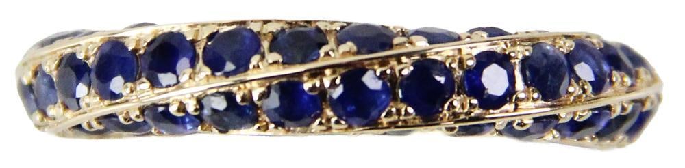 14k Gold and Sapphire Eternity Band: 14k gold and sapphire eternity band, size 7 1/2. Approximately 8.2 grams TW. Provenance: New York City, New York collection. PLEASE NOTE: payment for silver, gold, jewelry, and coins must be made via 